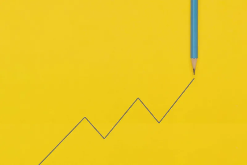 Pencil line graph showing business growth, representing a social media strategy for small businesses
