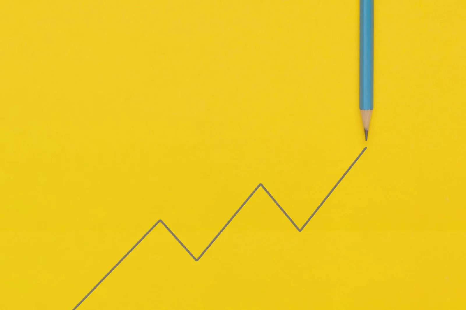 Pencil line graph showing business growth, representing a social media strategy for small businesses